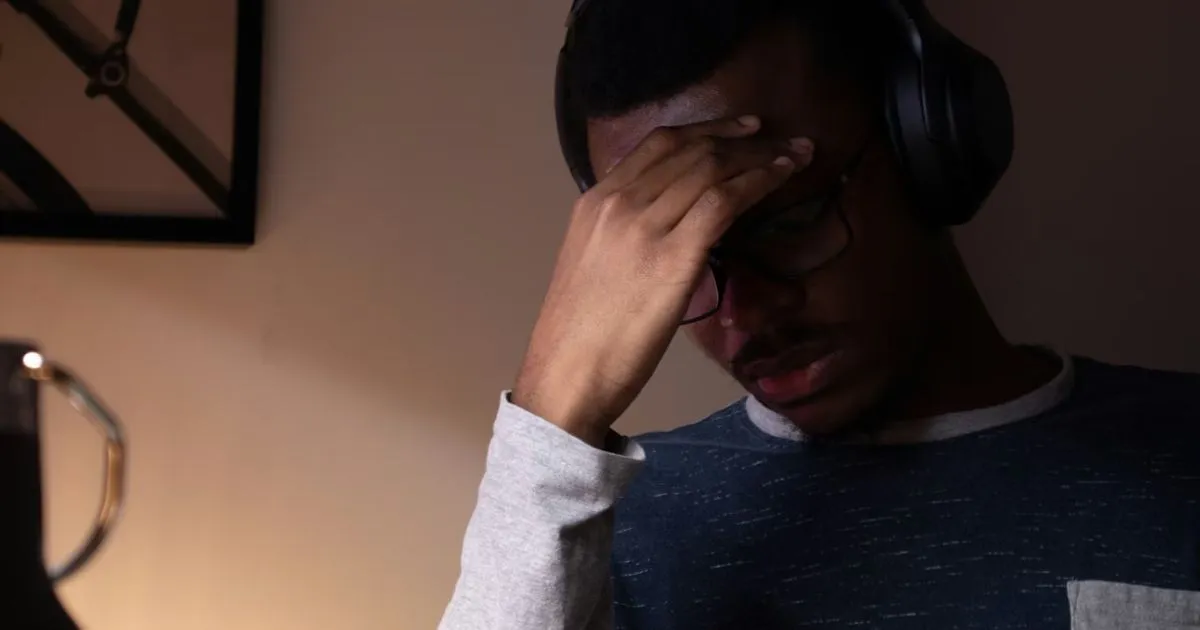 Frustrated person looking at screen after being blocked on Instagram