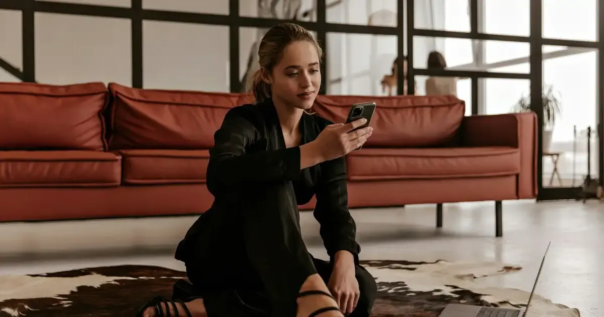 Woman checking her Instagram profile on her phone wondering who viewed it